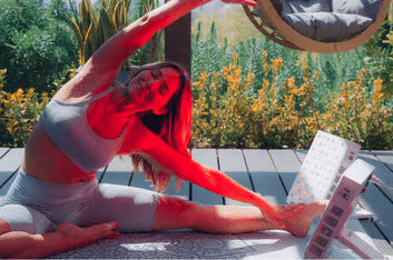 Vital Red LIght. Red Light Therapy. Room with red lighting, a massage table, exercise balls, LED red light panels, and