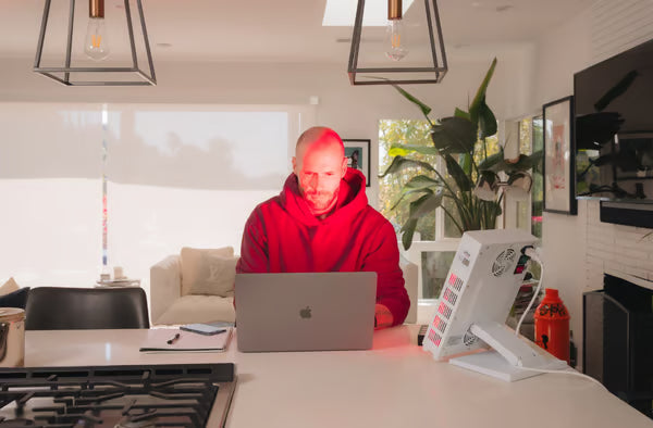 A man researching the benefits and risks of red light therapy|red light therapy dangers|led light therapy dangers