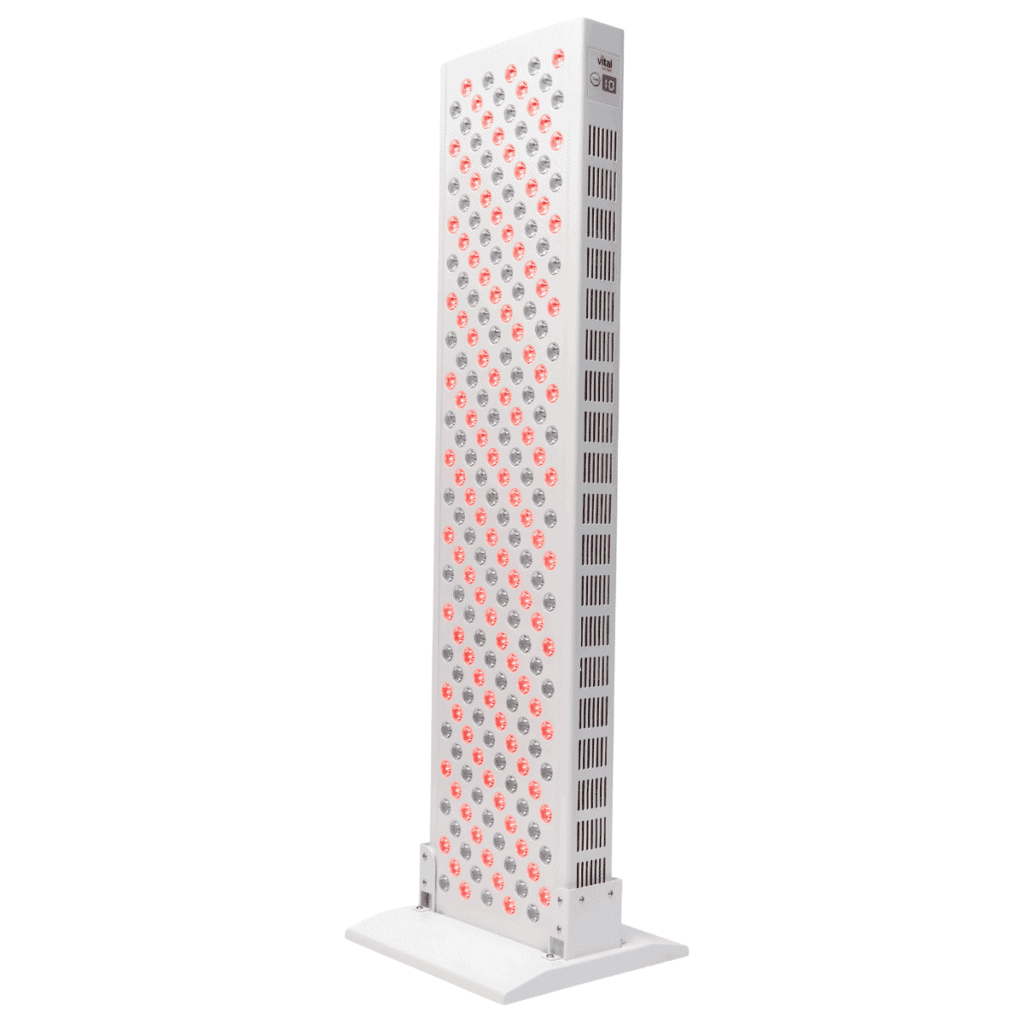 A tall, rectangular LED panel light with a grid of red lights and a white casing, standing vertically on a base.
